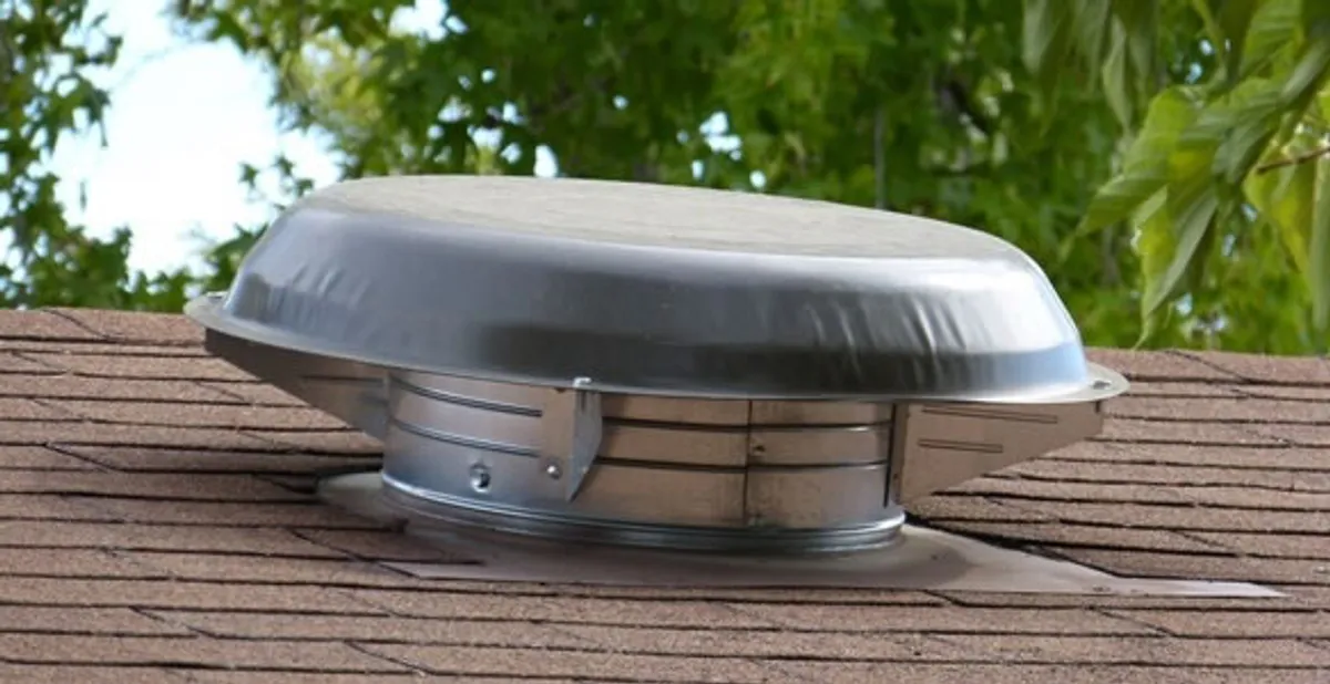 attic fan installation services with low-profile roof ventilation unit in Boston, MA
