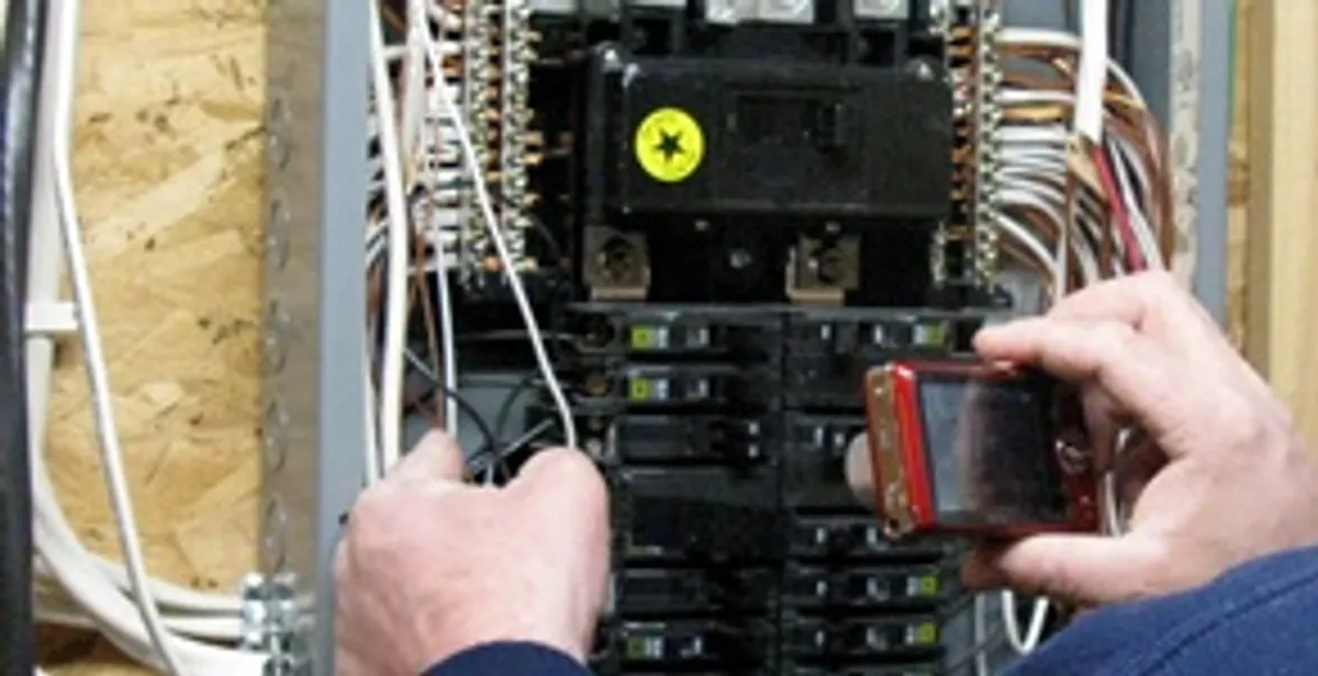 Home electrical inspection of circuit breaker panel by licensed electrician in Boston, MA