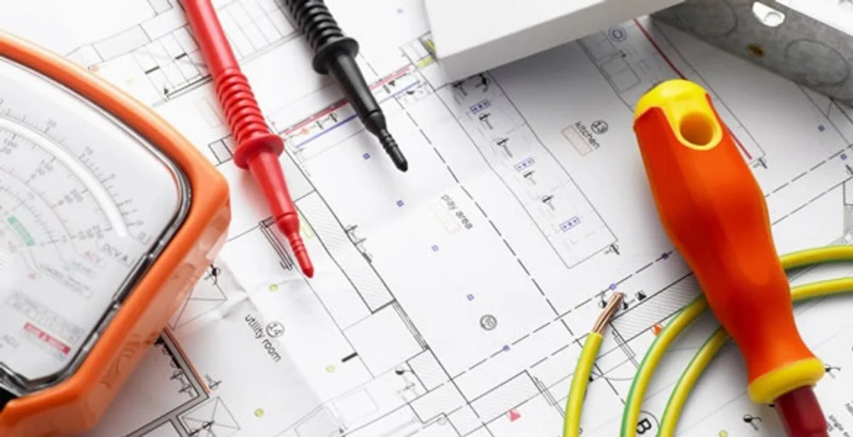 licensed electrician planning and testing electrical systems using professional tools in Boston, MA