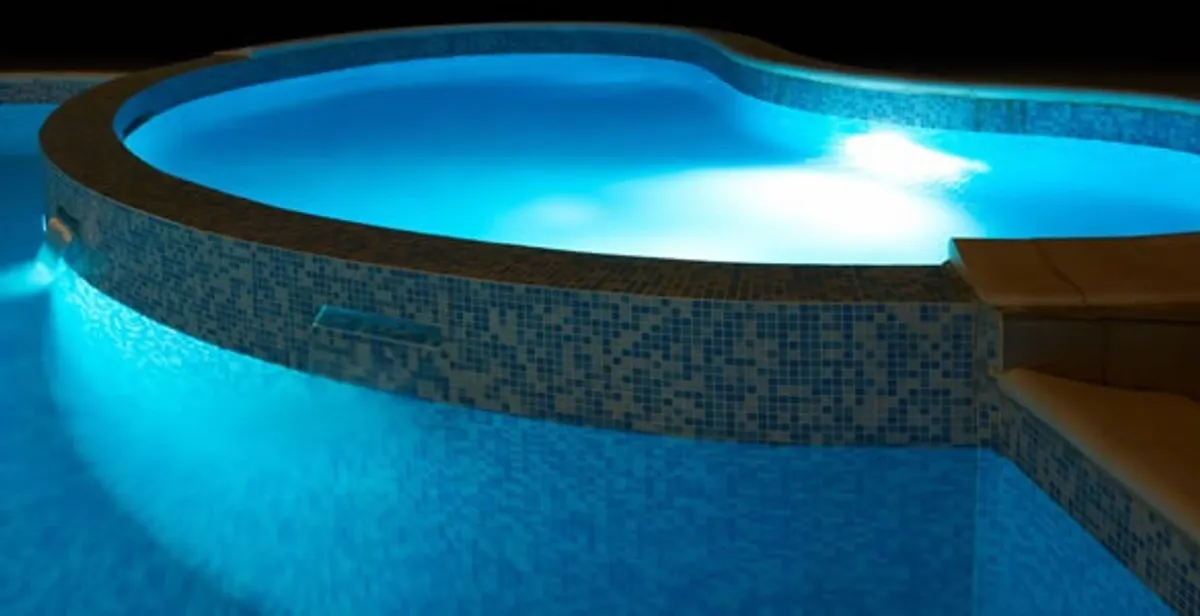 pool light installation and repair services highlighting illuminated pool interior lighting in Boston, MA