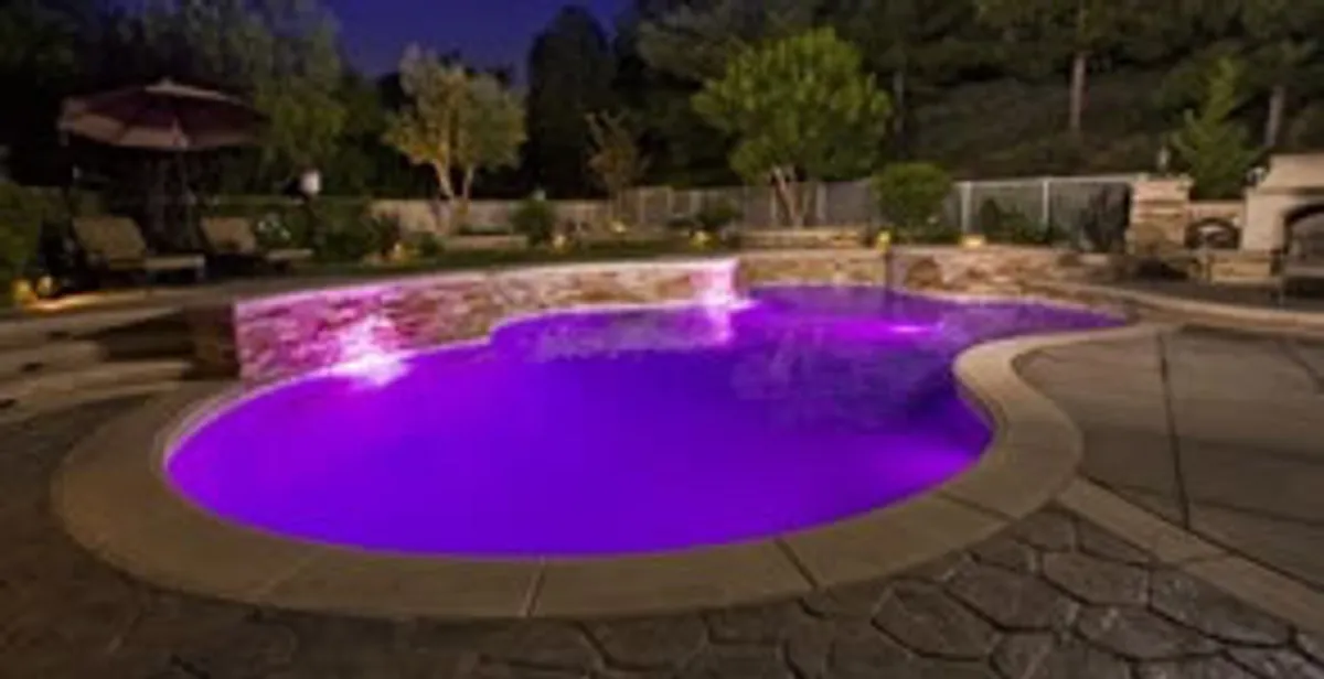 pool light installation and repair services illuminating a residential swimming pool in Boston, MA