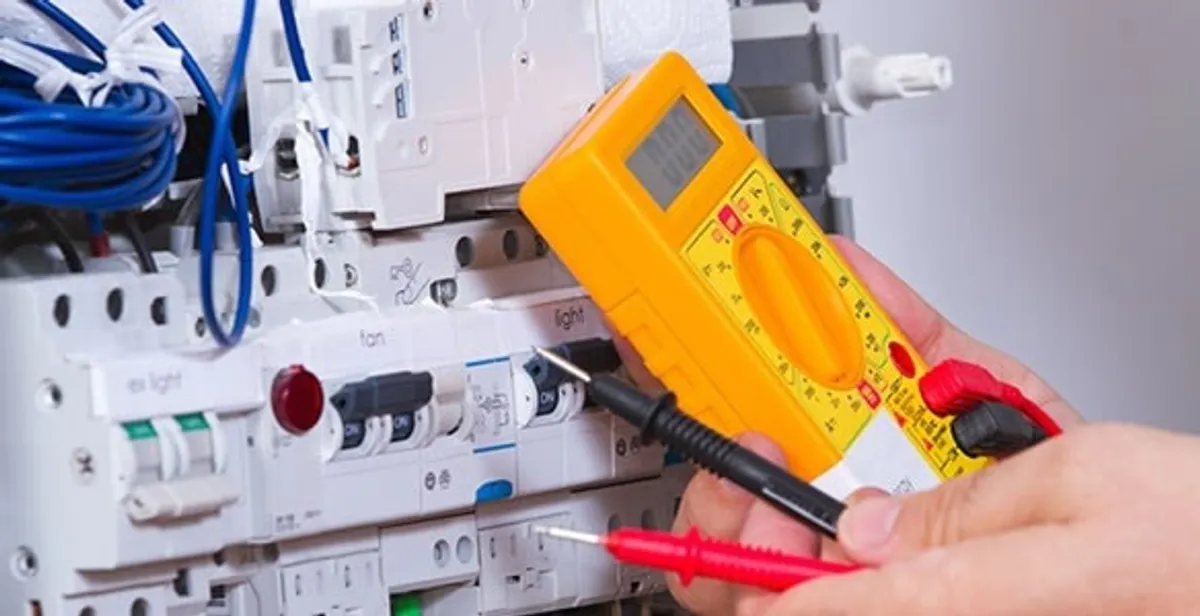 Residential electrician testing home electrical panel for safety and performance in Boston, MA