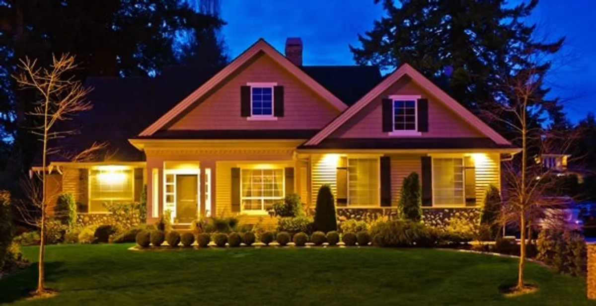 security light installation services illuminating a residential exterior at night in Boston, MA