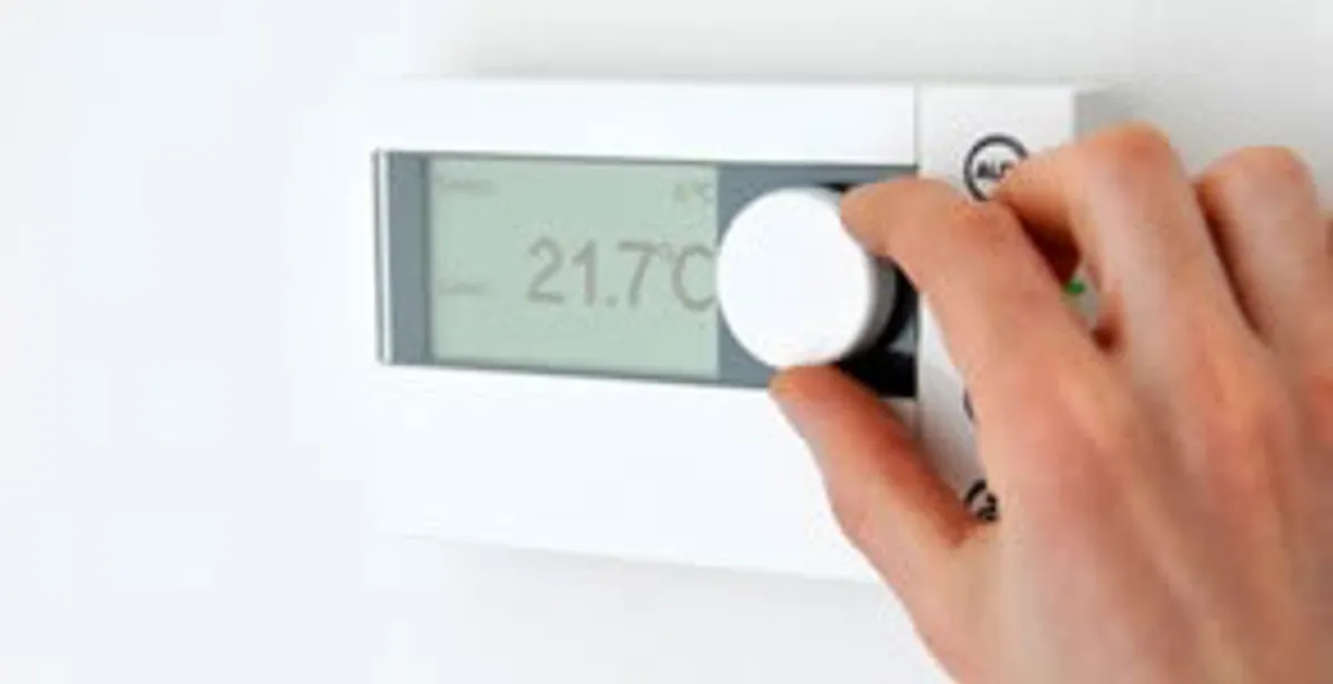 Thermostat installation service with professional adjusting temperature control in Boston, MA