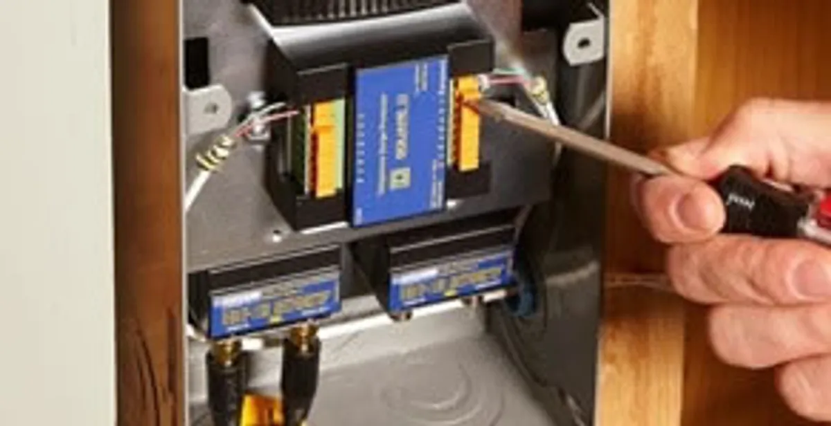 Whole home surge protection device being installed by a licensed electrician to protect electrical systems in Boston, MA